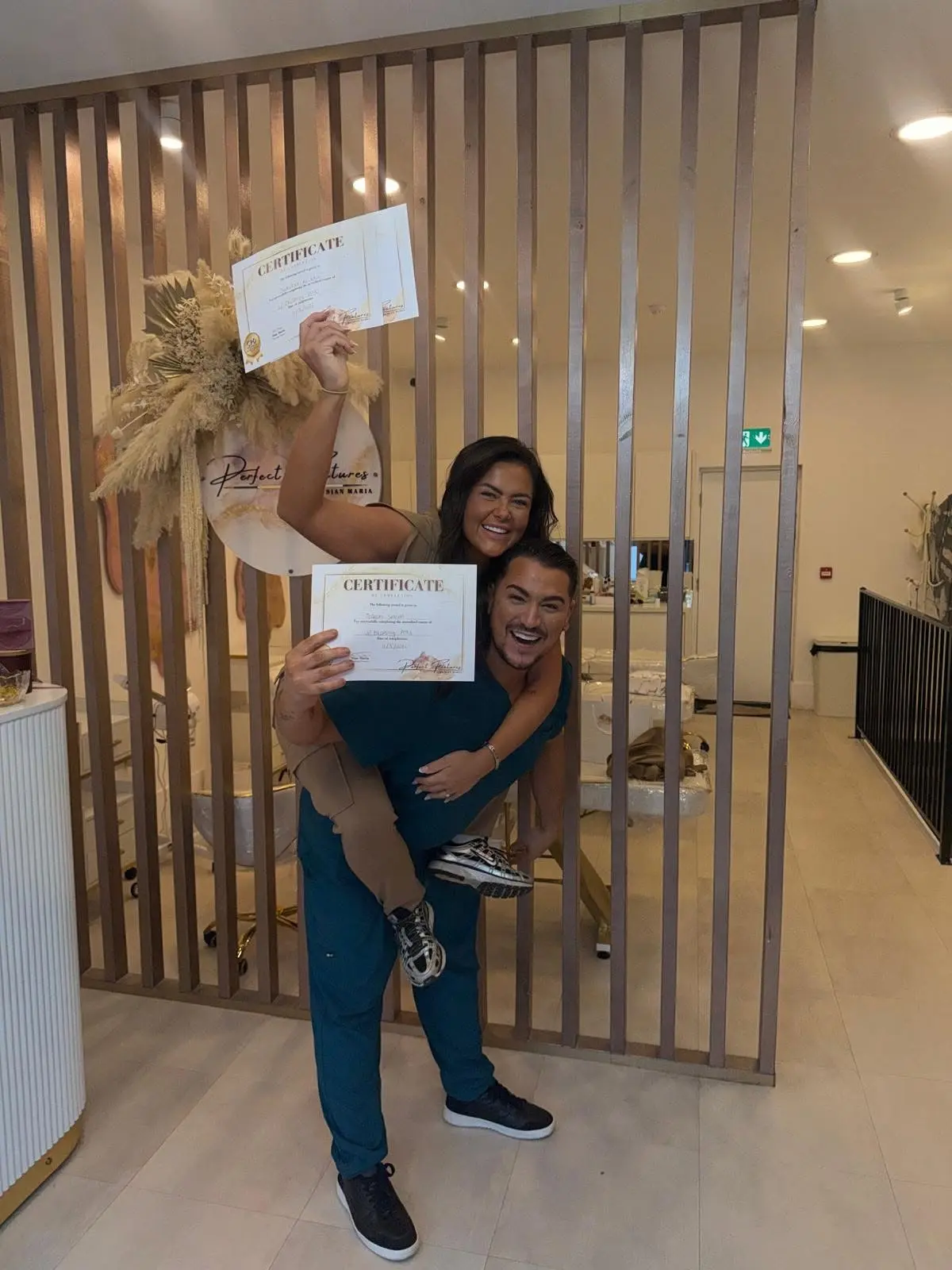 Perfect Features Training Academy student receiving aesthetics certification